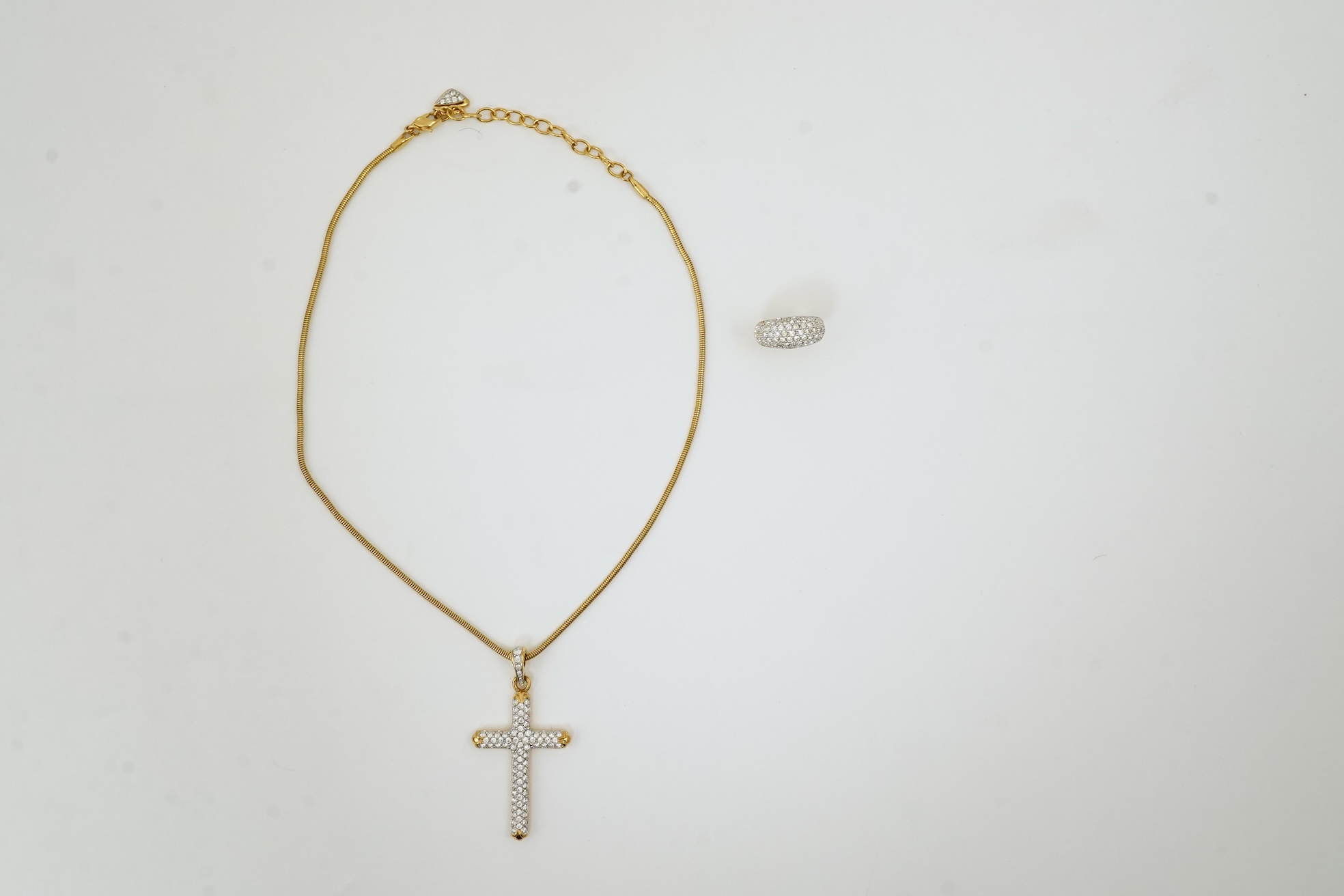 A Swarovski vintage cross necklace and ring.